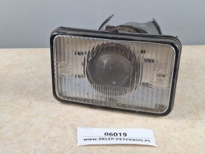 Reflektor HELLA nr 301-133 064, osłona nr 133 448, uszkodzona